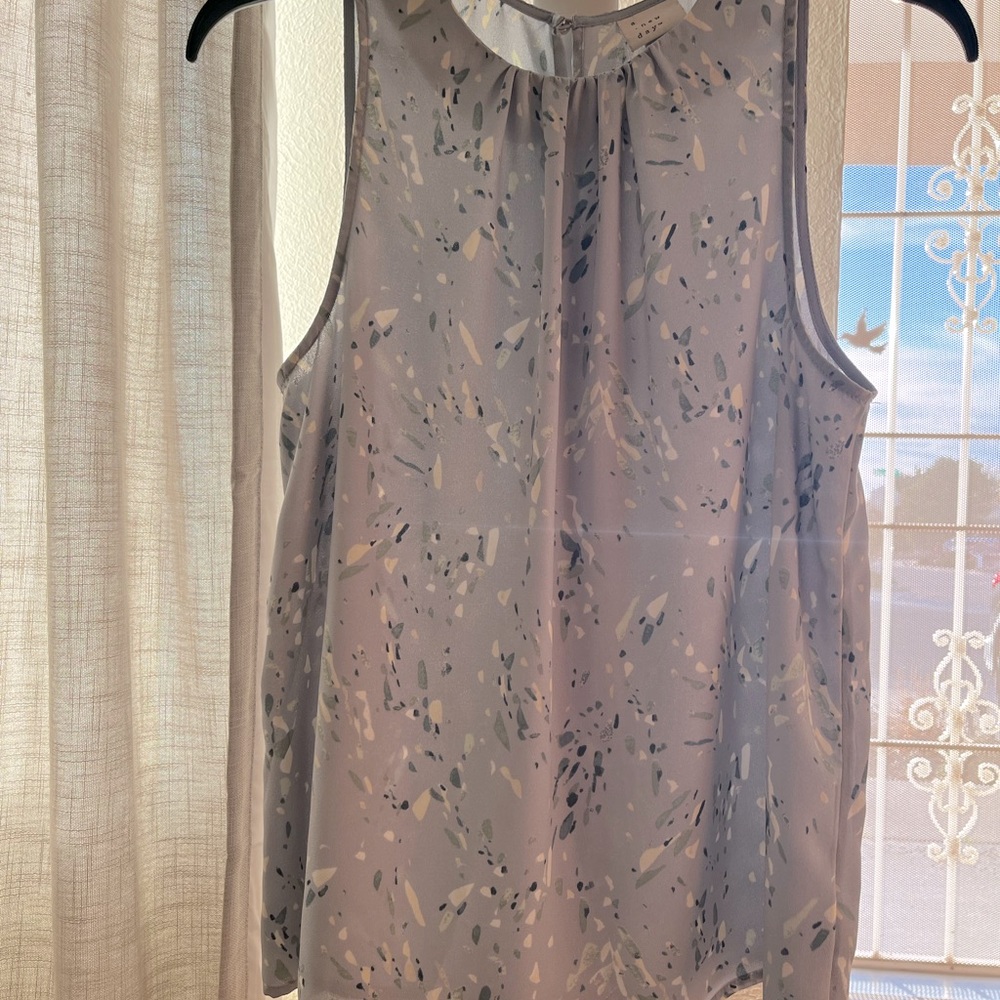 A New Day. Size small blouse. Baby blue with ivory, navy and sage. Gently used.